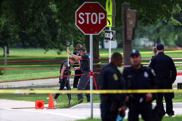Police investigate a crime scene where a man was fatally shot by visiting police officers in the King Park neighborhood on July 16, 2024 in Milwaukee.