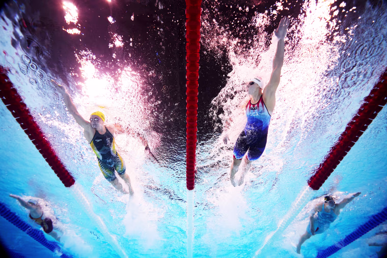 Ariarne Titmus of Team Australia and Katie Ledecky of Team United States compete in the Women's 400m Freestyle Heats on day one of the Olympic Games Paris 2024 at Paris La Defense Arena on July 27, 2024 in Nanterre, France.