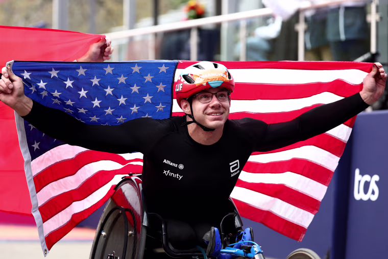 Daniel Romanchuk holds a US flag