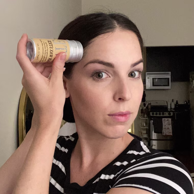 Applying the Samnyte Hair Wax Stick.