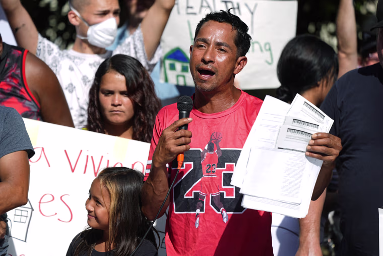 Resident Juan Carlos Jimenez speaks at a rally to address chronic problems in the apartment buildings Sept. 3, 2024, in Aurora, Colo.