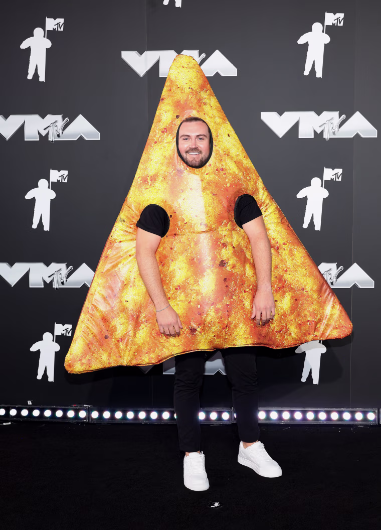 Image: Chippy, dressed in a tortilla chip costume.