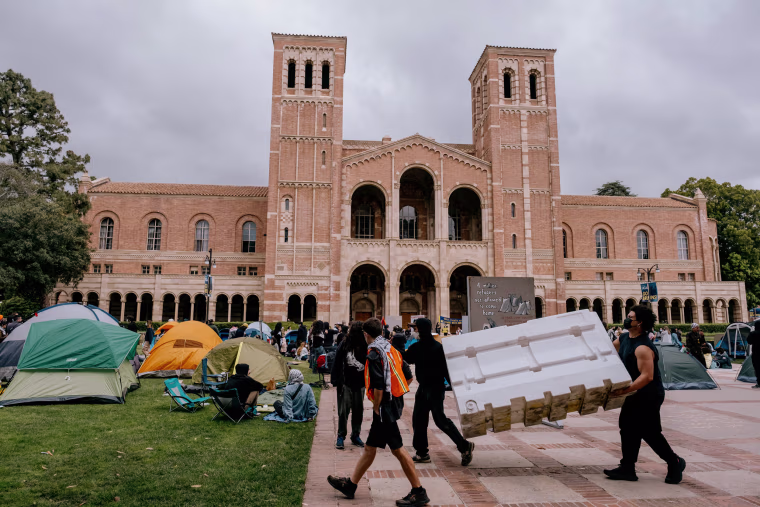 Pro-Palestinian protesters at a newly formed "solidarity" tent camp on the UCLA campus on April 25. UCLA now can't allow people to exclude students from any campus programs, spaces or activities.
