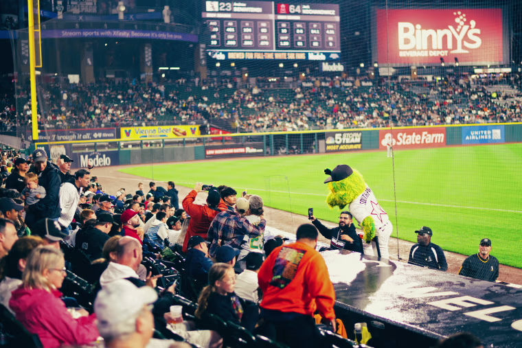 The crowd gathers around Southpaw, the Sox mascot.