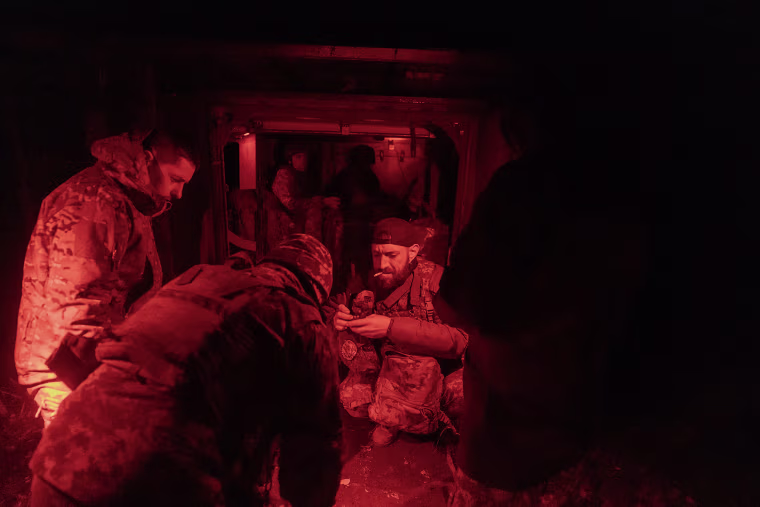 Ukrainian servicemen prepare to go to the frontline near Kurakhove in eastern Donetsk on Oct. 14, 2024.