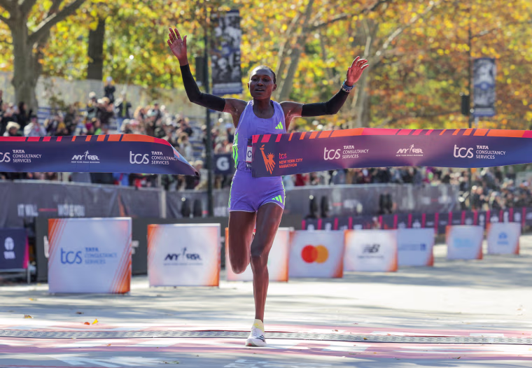 Sheila Chepkirui crosses the marathon finish line