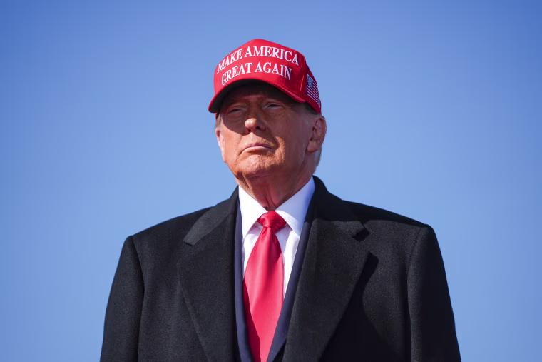 Donald Trump wears a "Make America Great Again" hat