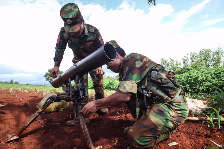 Members of the Ta'ang National Liberation Army (TNLA) prepare their weapons