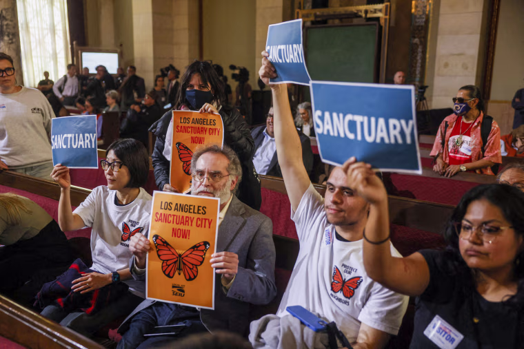 Activists with signs.