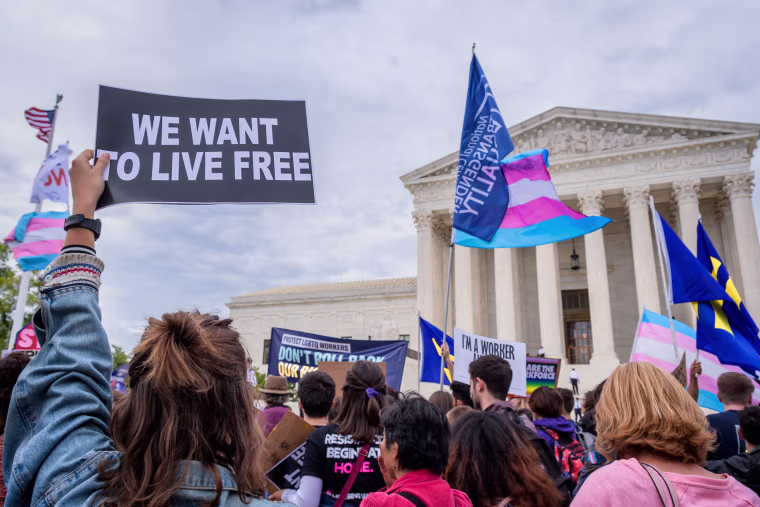Participant holding a sign outsithe the Supreme Court. 133