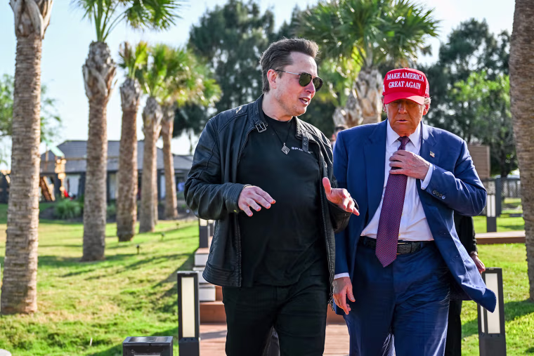 Elon Musk greets President-elect Donald Trump as he arrives to attend the launch of the SpaceX Starship rocket on Nov. 19, 2024 in Brownsville, Texas.