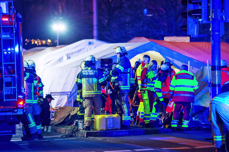 Emergency personnel next to the Christmas market after a car reportedly plowed into the crowd in Magdeburg, Germany.