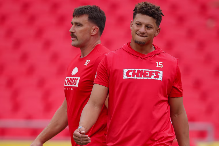 Kansas City Chiefs teammates Travis Kelce, left, and Patrick Mahomes during pregame warmups on Aug. 22, 2024.