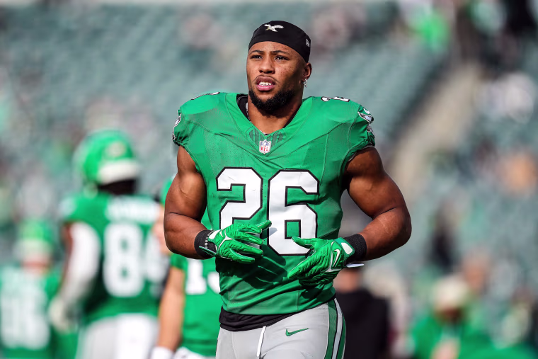 Saquon Barkley runs on the football field
