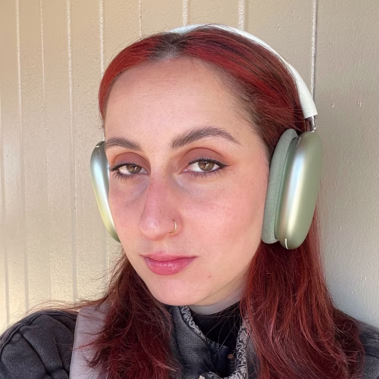 Headshot of the Apple AirPods Max headphones worn by former NBC Select editorial projects manager Rebecca Rodriguez.