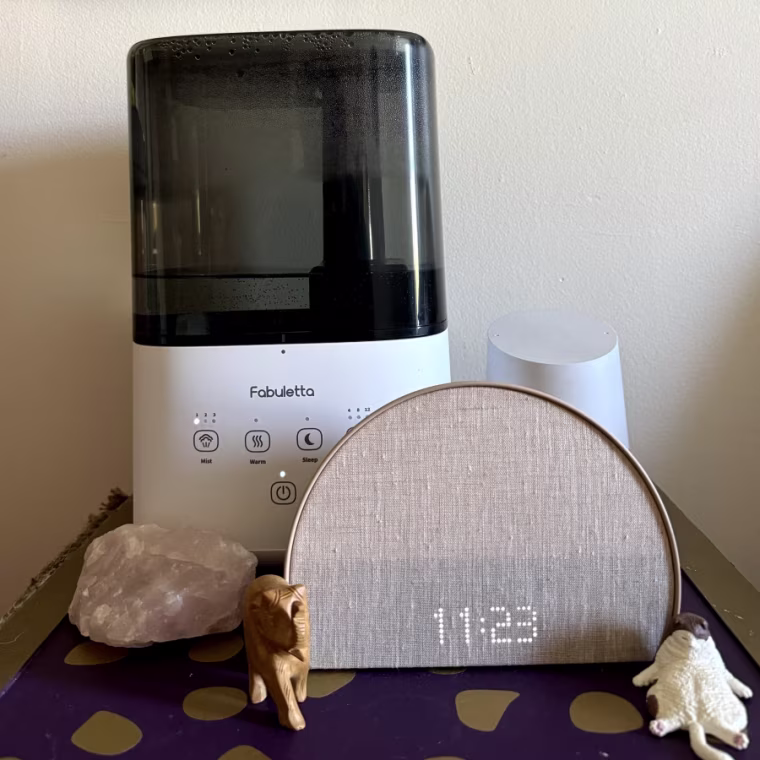 Fabuletta humidifier sitting on top of a purple nightstand.