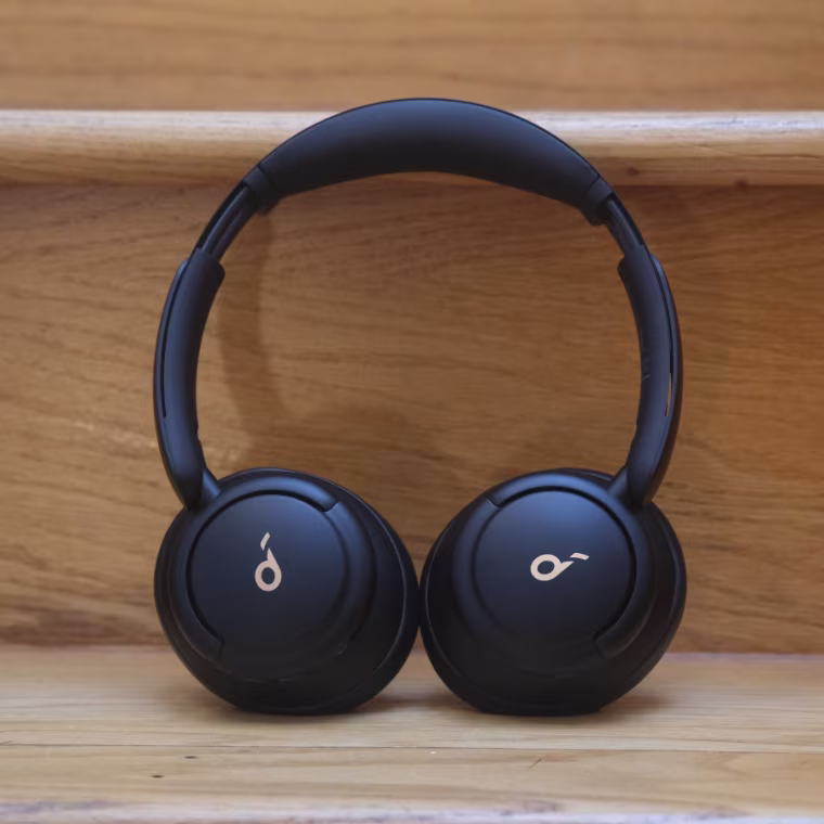 Close up shot of the Soundcore Life Q30 headphones leaning against a wooden stair.