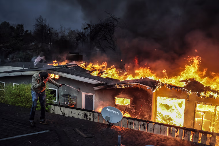 Eaton fire burns homes in Altadena.