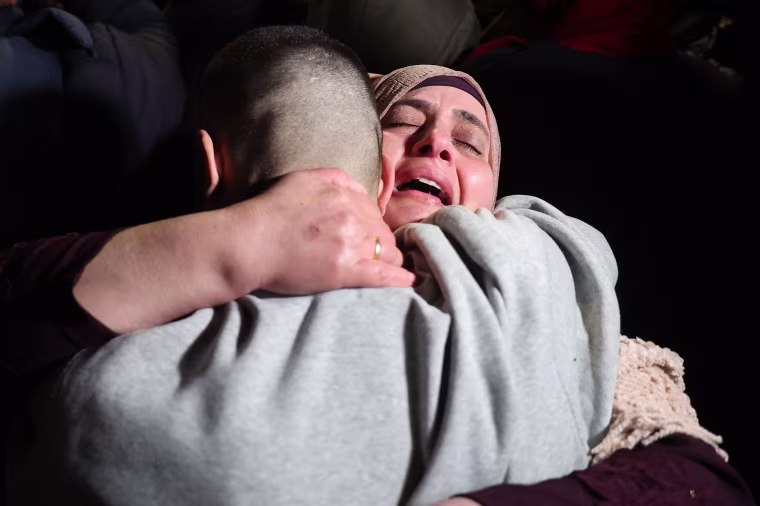 Crowds cheered, chanted and honked car horns as two buses carrying the prisoners arrived in Beitunia following their release as part of the Gaza ceasefire deal that began on January 19 and saw three Israeli hostages freed by Hamas in the Gaza Strip.