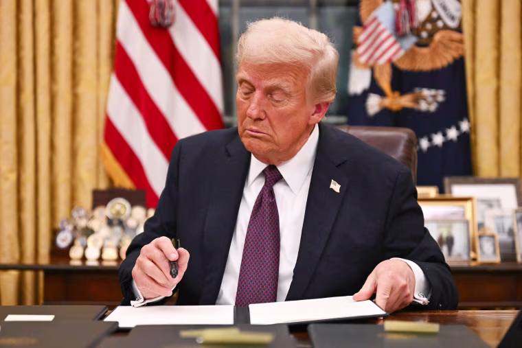 President Donald Trump signs an executive order on birth rights citizenship in the Oval Office
