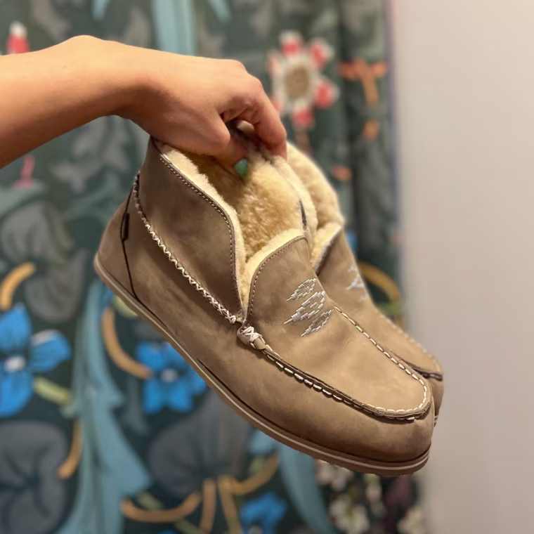 Commerce writer Jannely Espinal wearing her Hari Mari Alta Slippers.