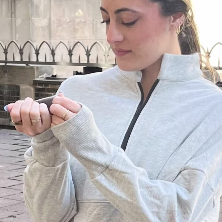 Murphy, fixing her sleeves.