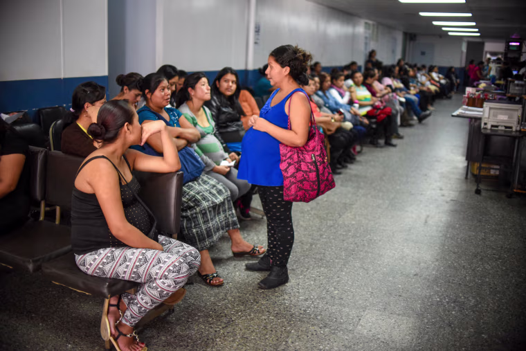 A group of pregnant women wait to be attended.