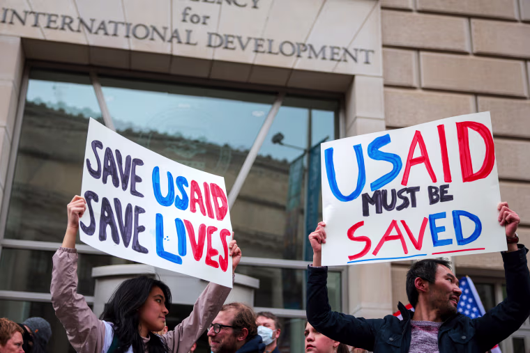 Protestors outside the USAID headquarters.
