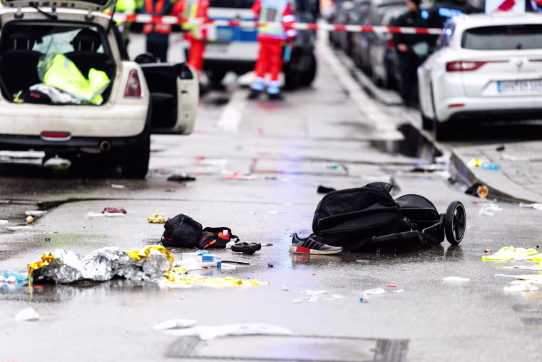 A stroller is discarded with other personal items after a car ramming in Munich on Feb. 13, 2025.