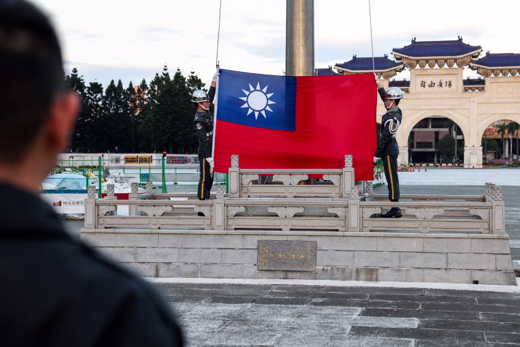 Guards raise Taiwan's national flag