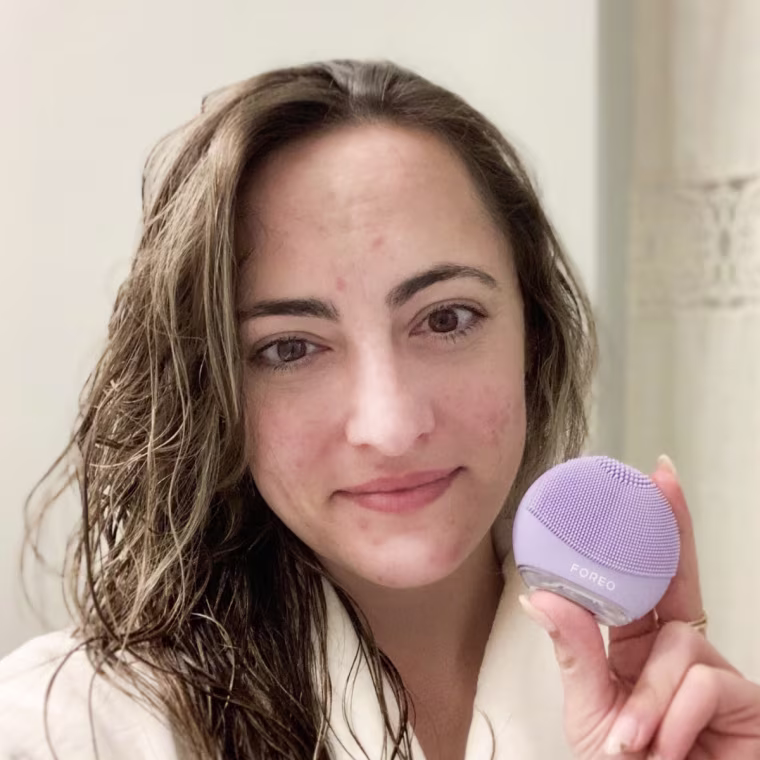 Commerce writer Danielle Murphy using the Luna 4 Go Facial Cleansing & Massaging Device.
