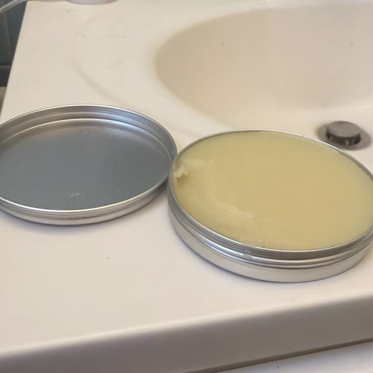 Man adding the beard balm to his beard.