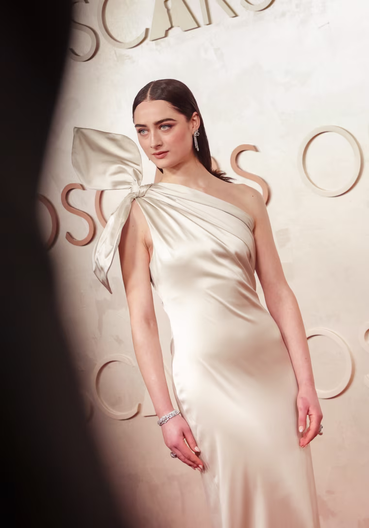 Raffey Cassidy from "The Brutalist" looks lovely in a dress with a sculptural bow.