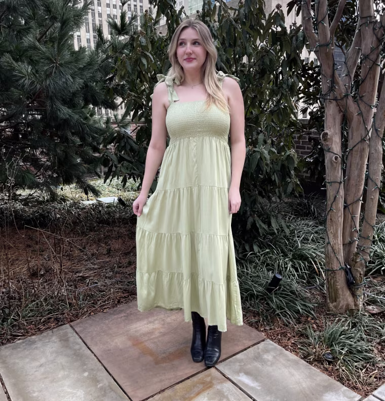 Commerce partnerships coordinator Aidan Bradley tries the Kinstell Flowy Long Dress.