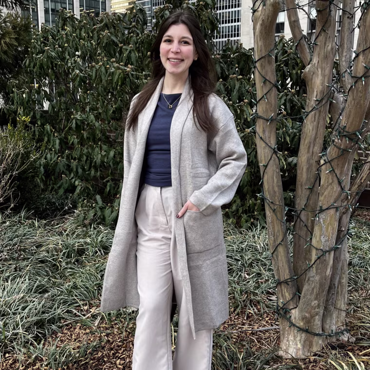 Commerce partnerships associate Victoria Herlocker tries the Anrabess Long Open Front Cardigan.