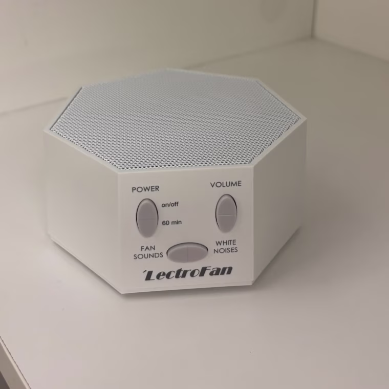 Lectrofan sound machine sitting on a white surface.