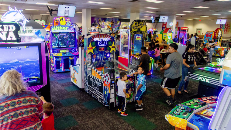 People play inside of an arcade