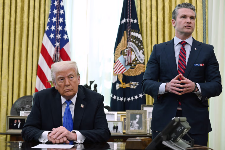 President Donald Trump listens as Secretary of Defense Pete Hegseth speaks in the Oval Office on March 21, 2025.
