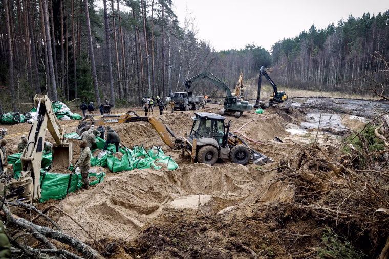 Image: Military personnel work at the site of a rescue operation for missing U.S. soldiers