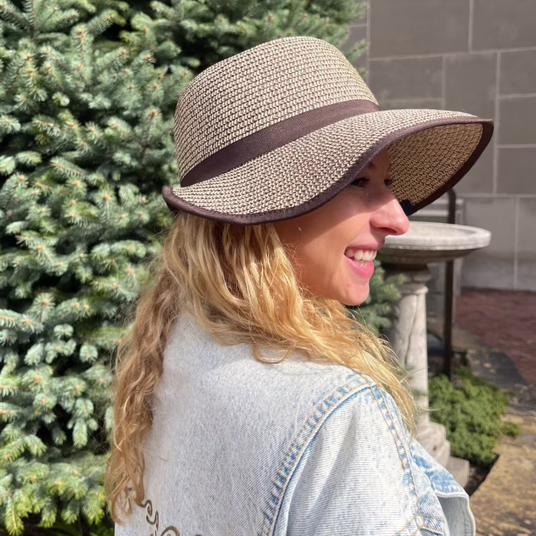 Producer Eden Strassburg tries the Lands' End Facesaver Sun Hat.