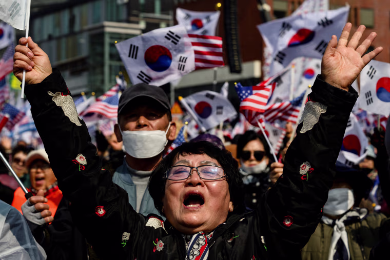 Supporters of South Korea president Yoon Suk Yeol react prior to the announcement of the Constitutional Court's verdict on Yoon's impeachment outside the presidential residence in Seoul on April 4, 2025.
