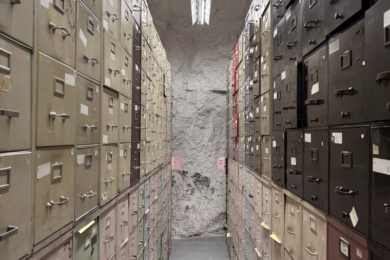 The warehouse-like OPM space inside the mine has accumulated more than 400,000,000 individual records, spread across 26,000 file cabinets, in some places stacked 10 high. 