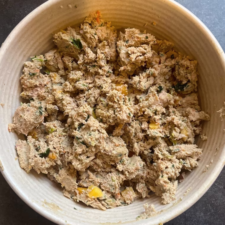White bowl with fresh dog food