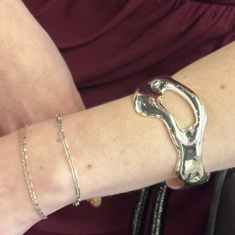 Production associate Audrey Ekman wearing her Ettika cuff bracelet.