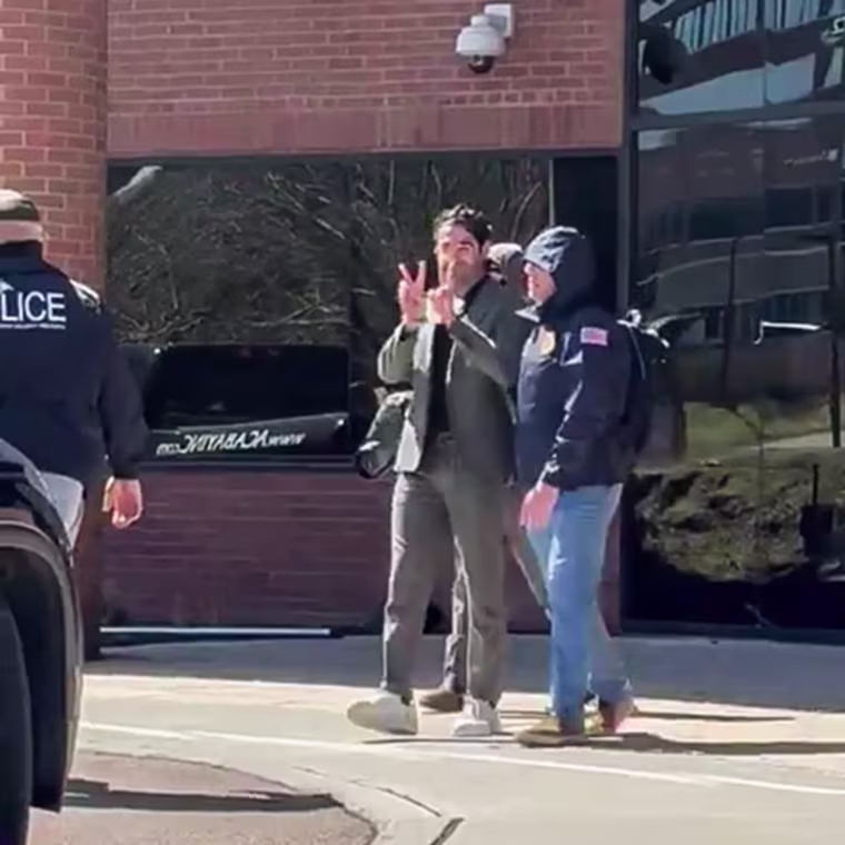 Mohsen Mahdawi being escorted by authorities in Colchester, Vt., on April 14, 2025.