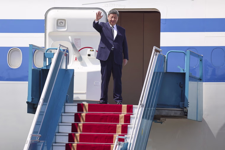 Chinese President Xi Jinping boards his plane following his visit to Vietnam on April 15, 2025.