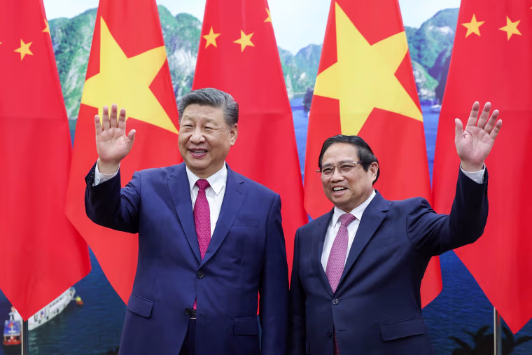 China's President Xi Jinping and Vietnam's Prime Minister Pham Minh Chinh before their meeting at the Office of the Party Central Committee in Hanoi on April 14, 2025.