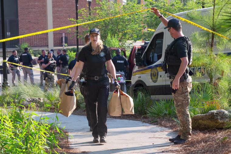 An investigators carries bags