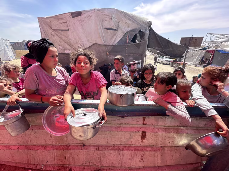 Waiting for food in Gaza.
