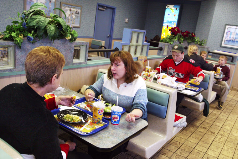Customers eating inside a BK location.
